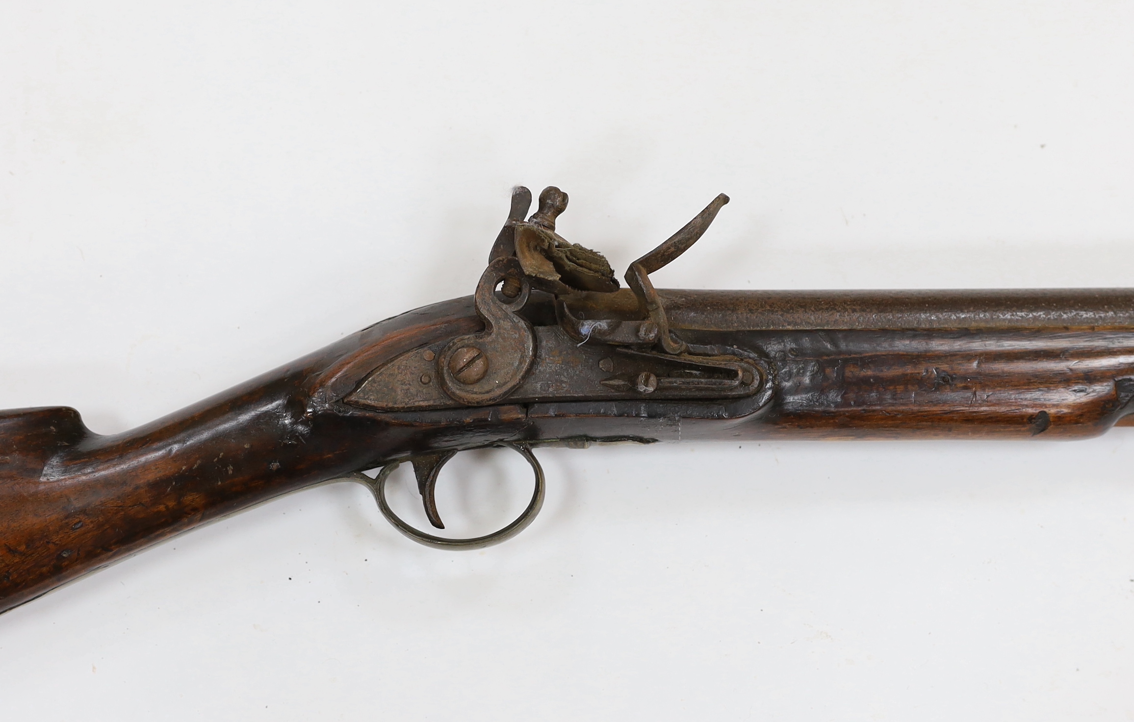 A flintlock blunderbuss fitted with a regulation British military service lock, stamped with tower and crown, GR civilian brass mounts, full stocked with wooden ramrod, barrel 36.5cm